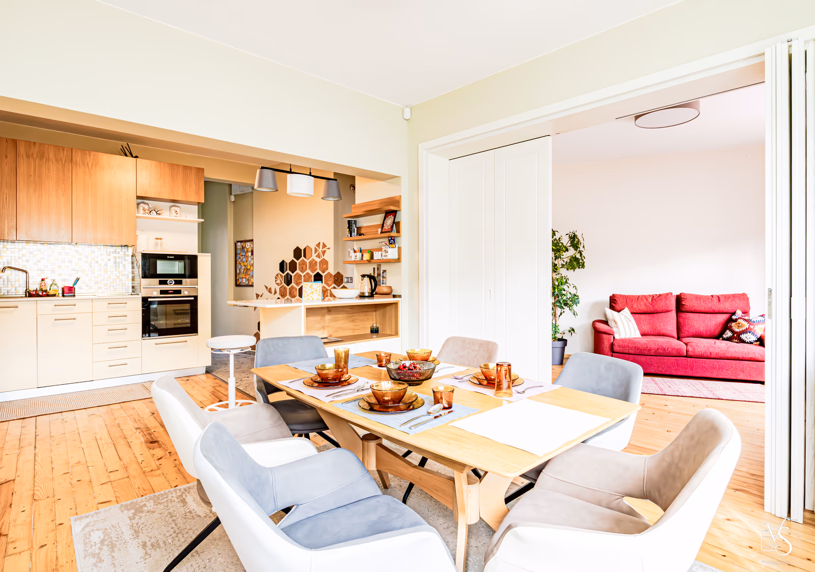 The living room — open, sunlit, 110 square meters of breathing room