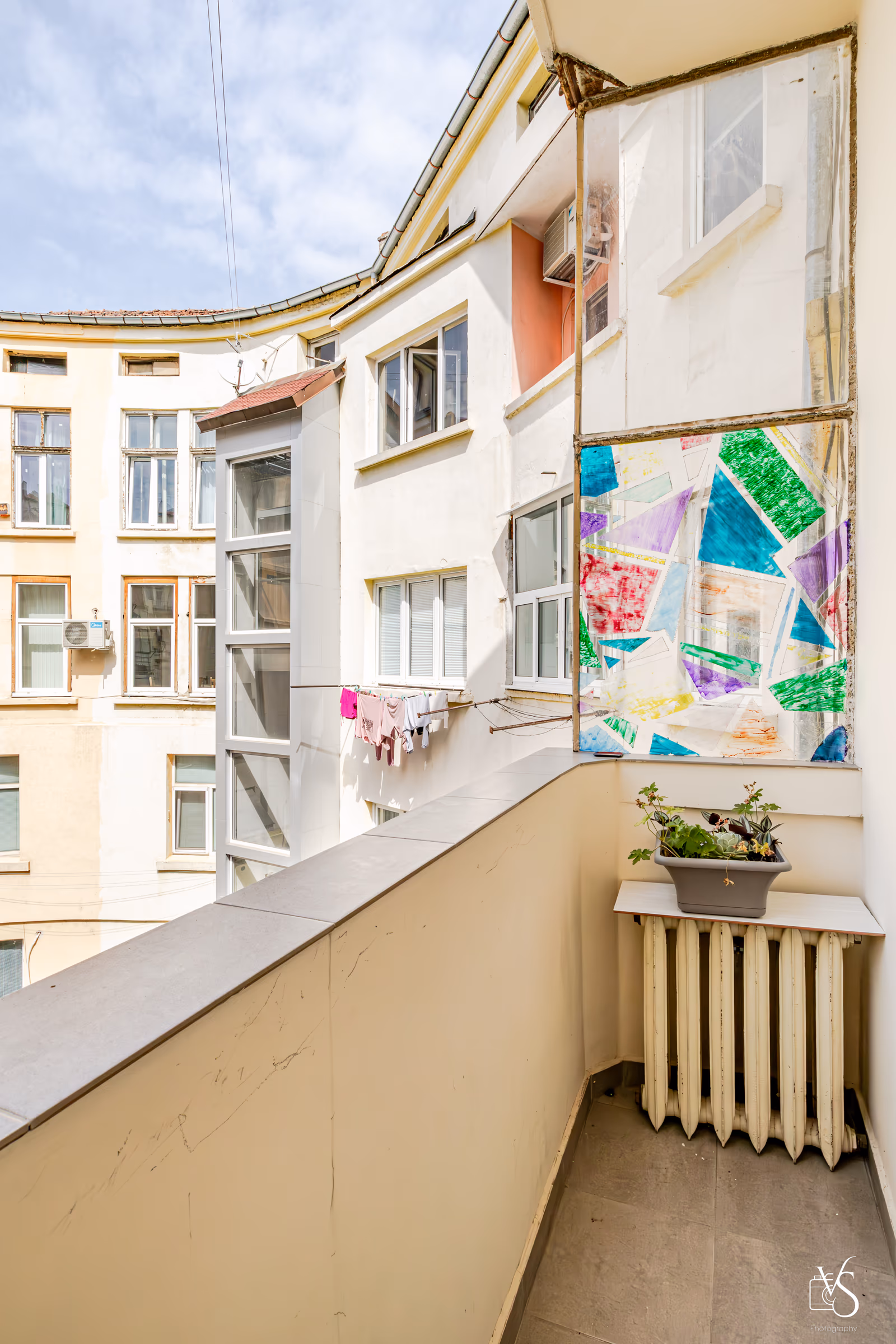 The balcony — morning light over Slaveykov Square